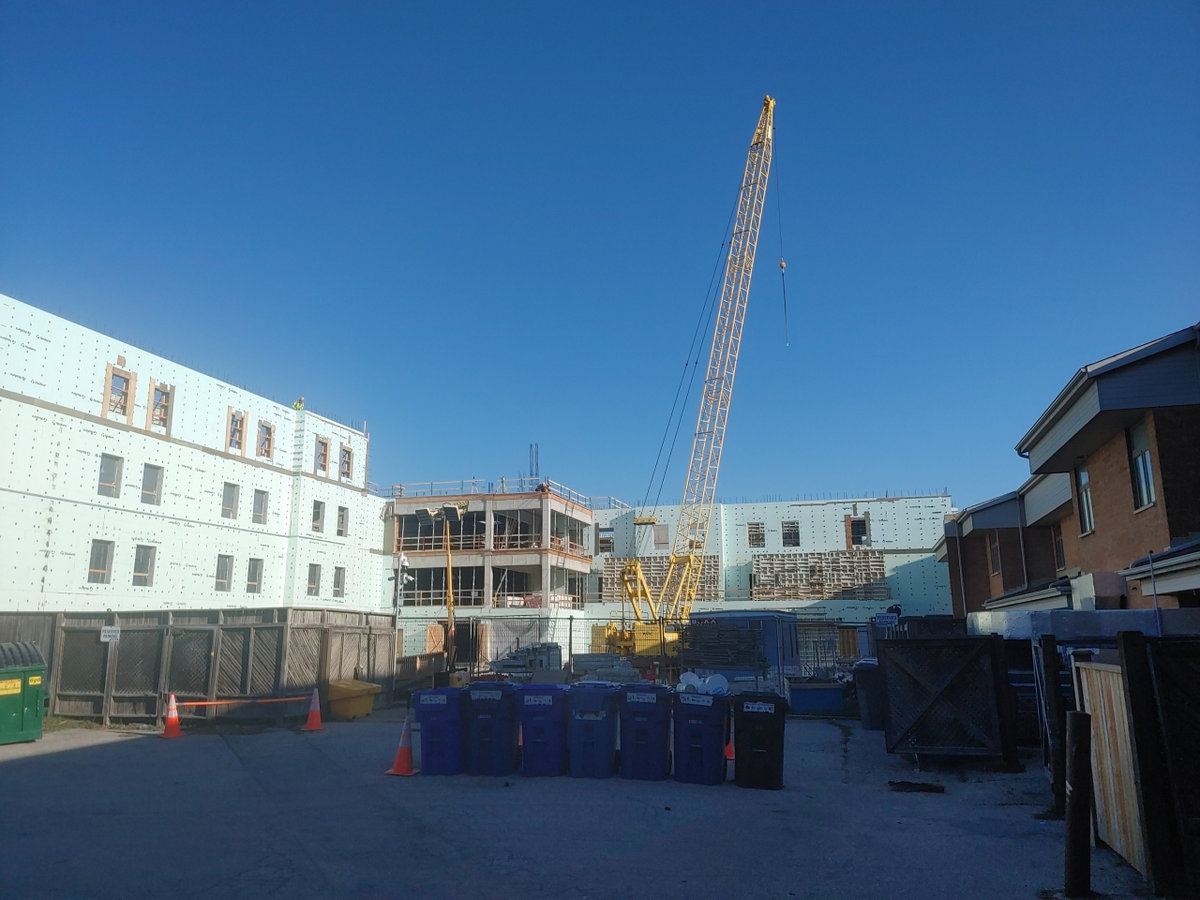 yellow crane in construction site